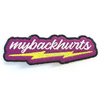 Hot pink patch with white 'mybackhurts' script above a yellow lightning bolt